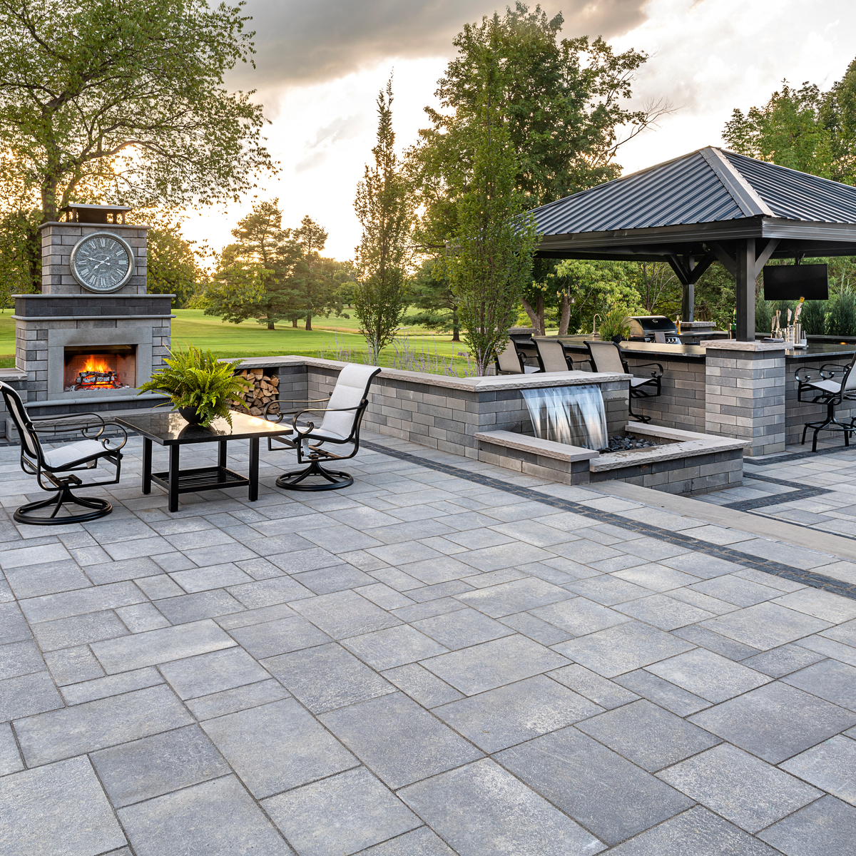 Backyard Patio Pavers with Water Feature and Outdoor Fireplace
