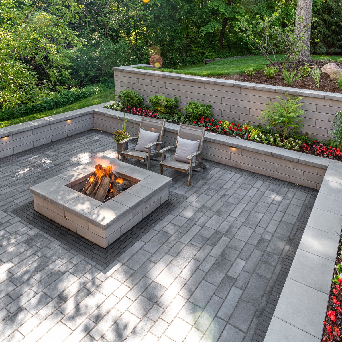 Sunken fire pit with retaining wall and softscaping