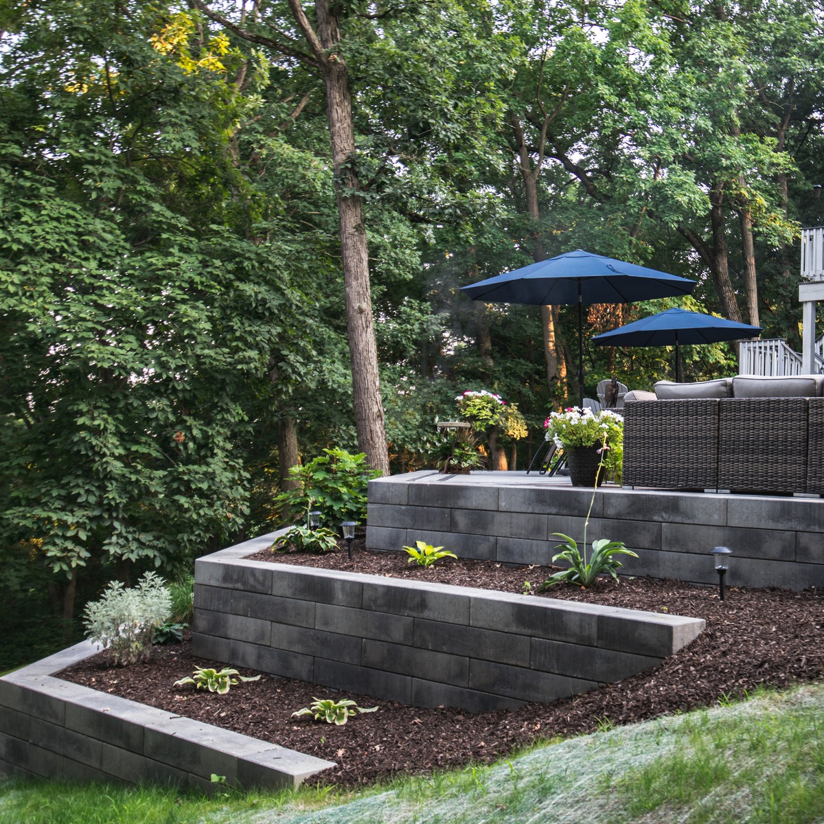 Multi-layered retaining wall with softscaping