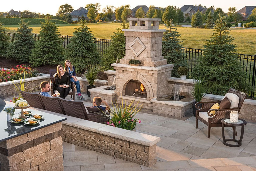 Outside Fireplaces, are impactful for creating warm landscape designs 