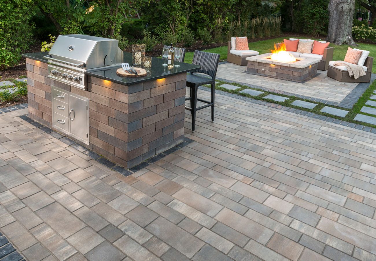 Unilock Patio with Kitchen Island Grill and Outdoor Fire Pit
