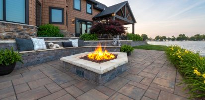 Outdoor Fire Pit with Dog sitting on surrounding Retaining Wall Seating