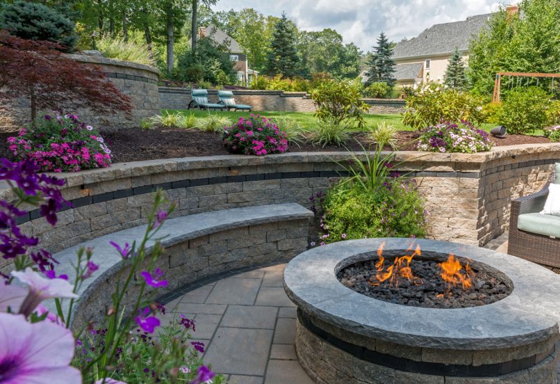 Multi-Level Curved Retaining Wall with seating around Outdoor Fire Pit