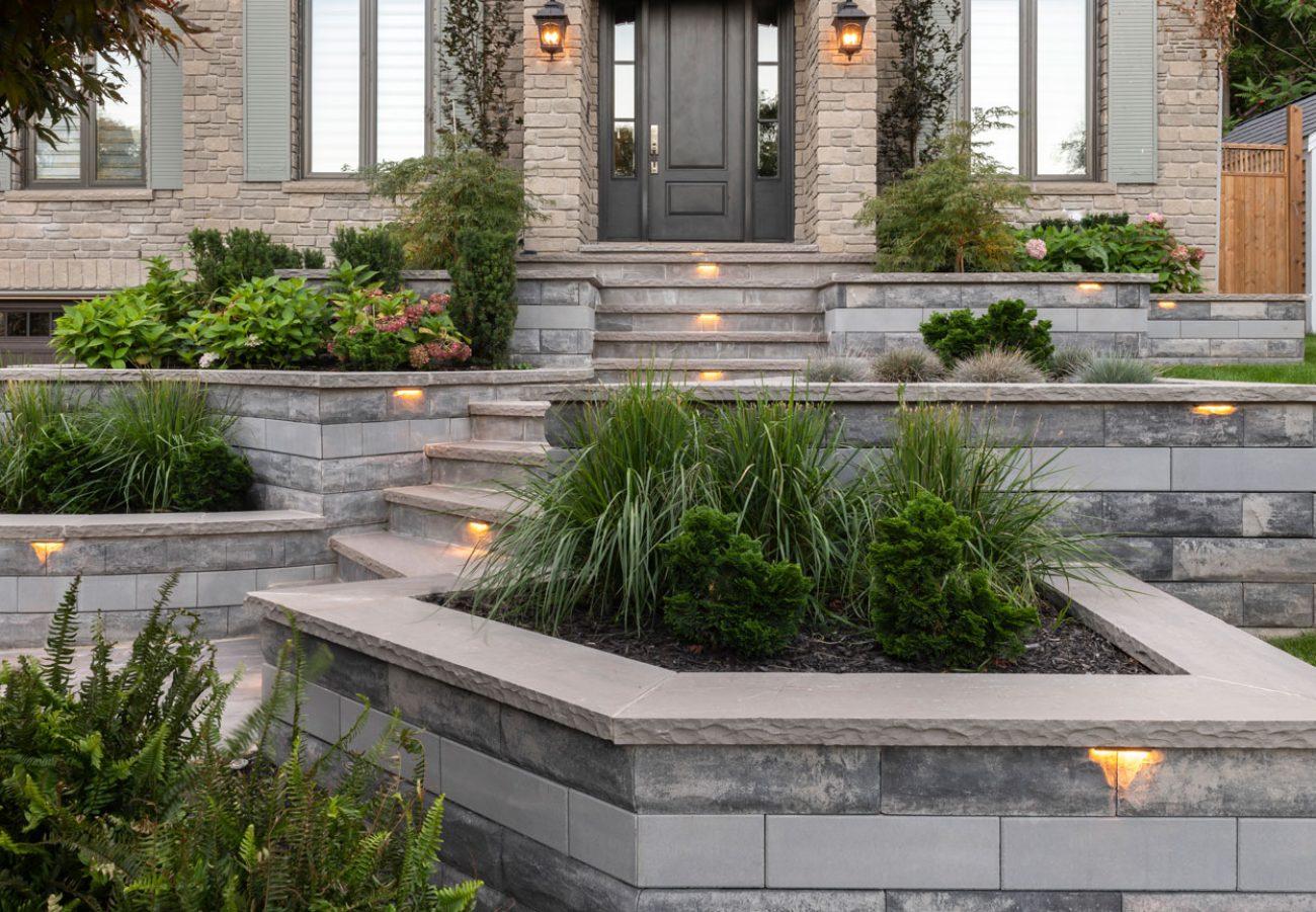 Retaining Wall Plant Beds Surrounding Front Entrance Steps with Lighting