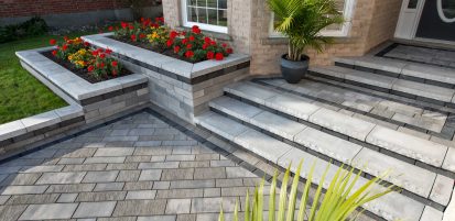 Elegant Front Entrance with Unilock Paver Steps and Retaining Wall Plant Beds