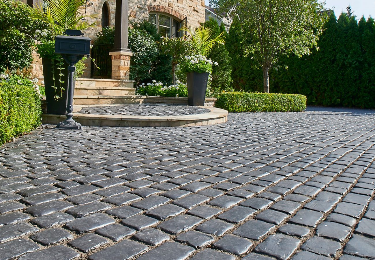 Charming Unilock Interlocking Pavers with Curved Step to Front Entrance