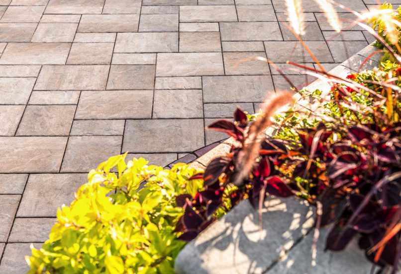 Close up of Unilock Beacon Hill Flagstone Patio and Retaining Wall Plant Beds