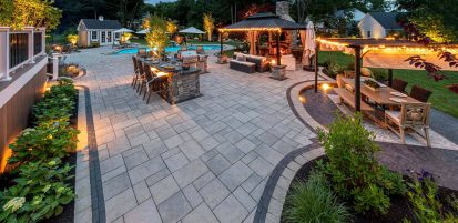 Summer Fun Backyard with Lighting and a Pool and Outdoor Kitchen and Fire Pit