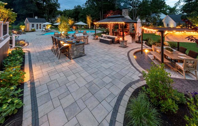 Summer Fun Backyard with Lighting and a Pool and Outdoor Kitchen and Fire Pit
