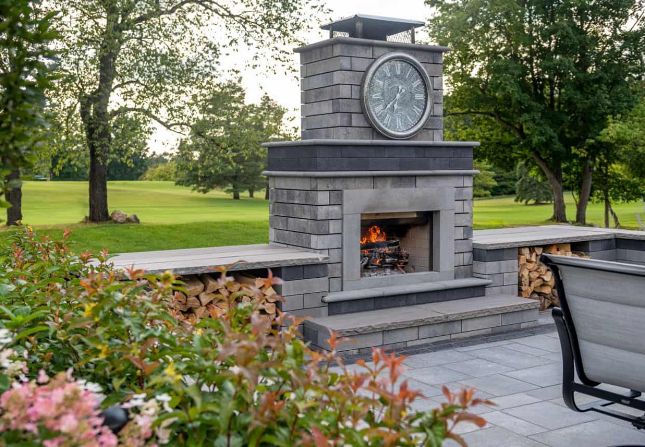 Unilock Outdoor Fireplace with surrounding Retaining Walls