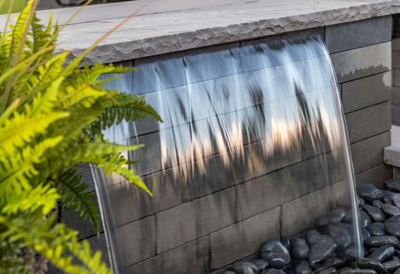 Close up of Unilock Waterfall Feature with Retaining Wall