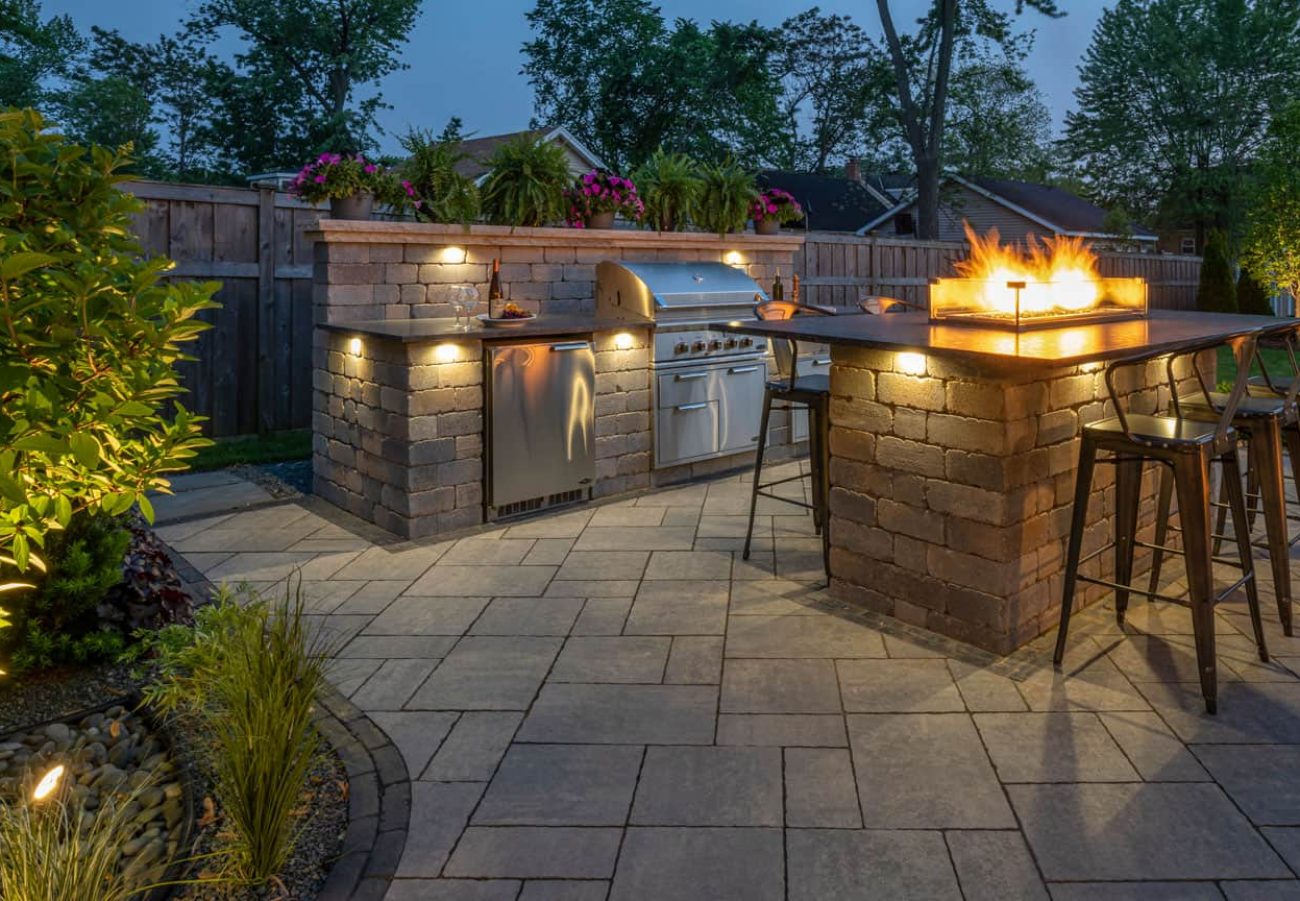 Outdoor Living Space with Kitchen Island and Fire Feature