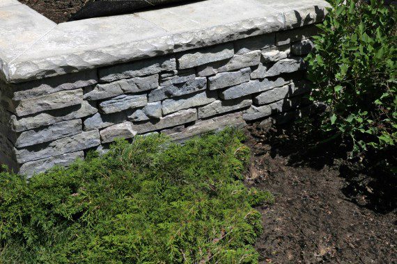 Building a Retaining Wall That Complements a Nature-Inspired Landscape Design in Albany, NY