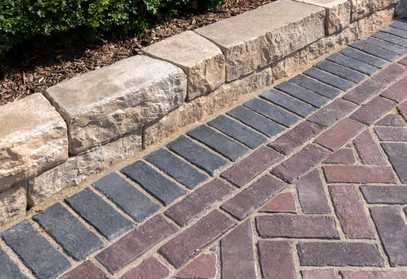 Close up of Unilock Paver Driveway with Boarders and Retaining Wall