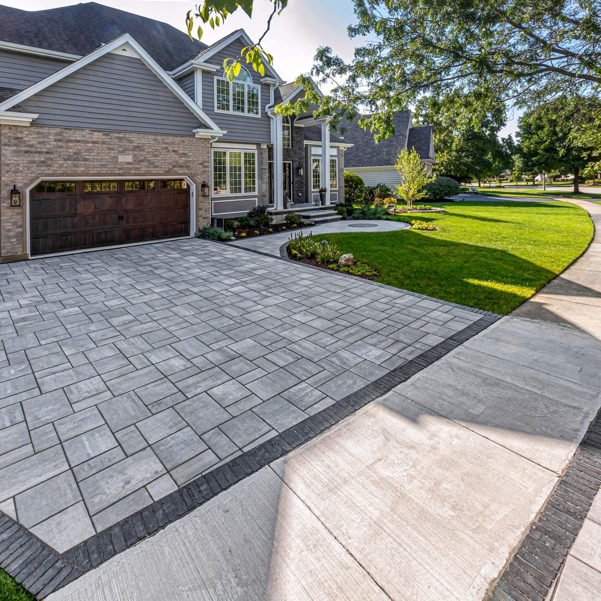 Interlocking paver driveway in front of house