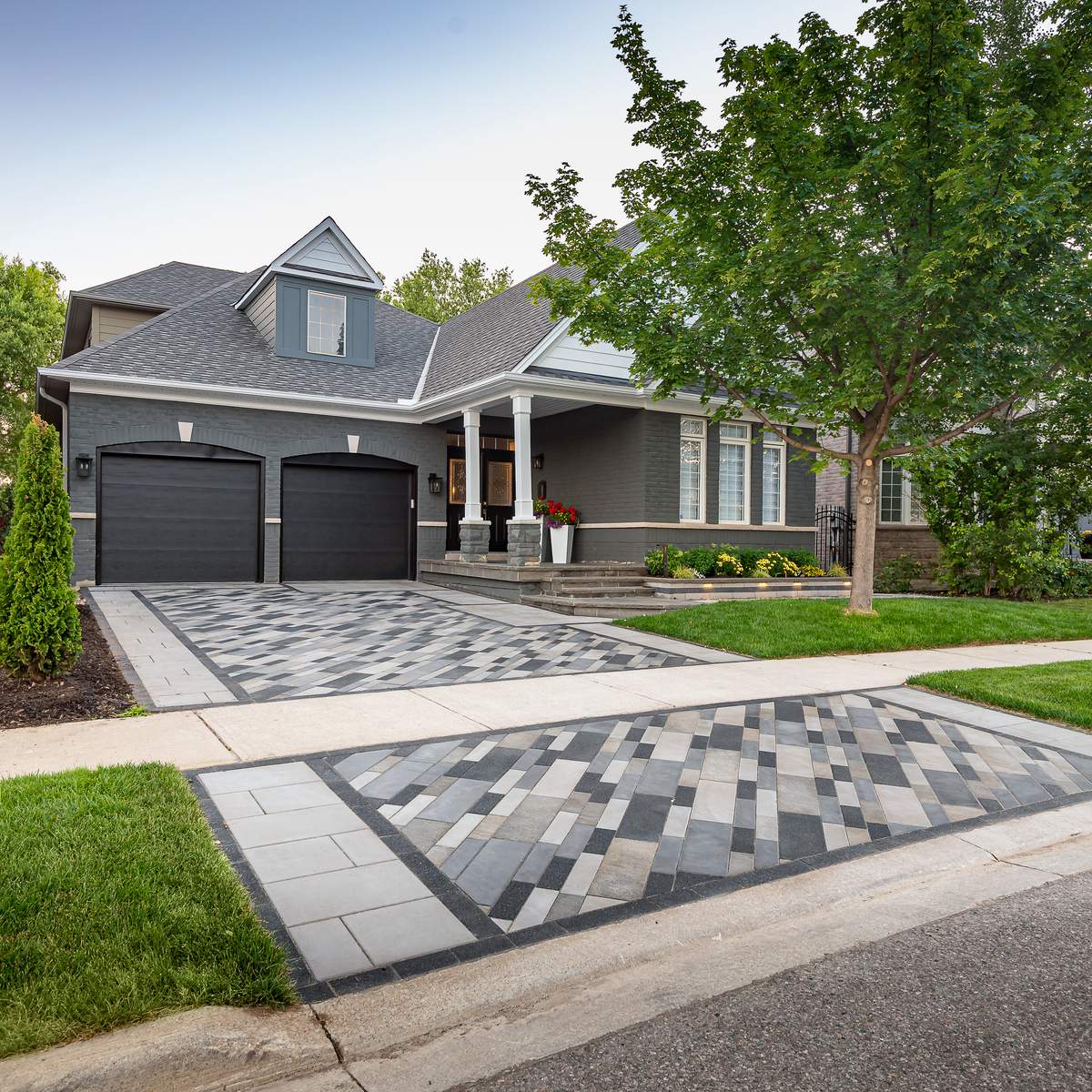 Multi-colored plank-style pavers in front of a home