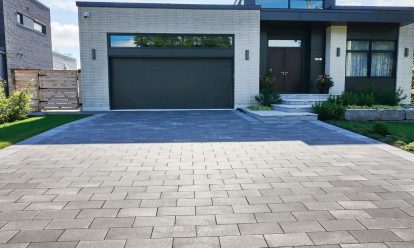 Large pavers in running bond pattern used on driveway in front of home