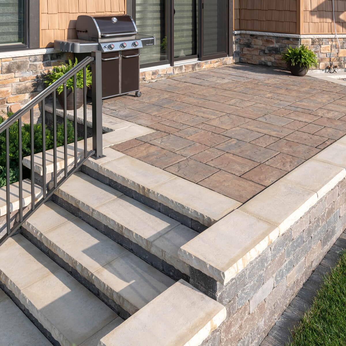 Raised Patio with Retaining Wall and Steps Down to Lower Area
