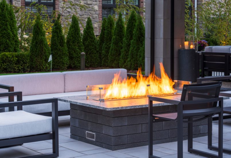 Unilock Outdoor Patio with Elevated Fire Feature