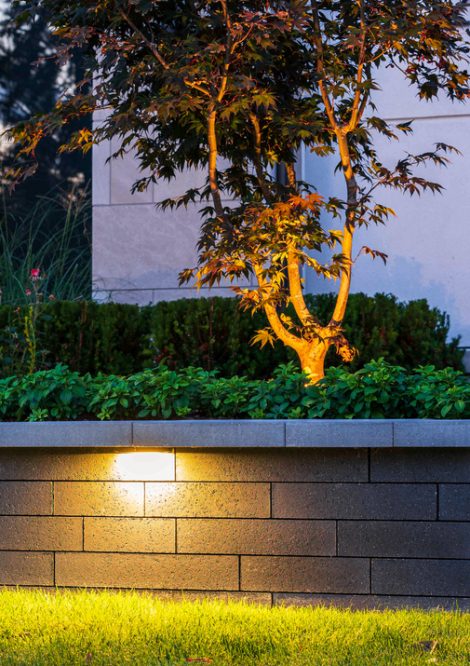 Unilock Retaining Wall with Lighting and Plant Beds