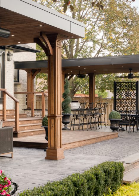 Gazebos on Outdoor Unilock Raised Patio with Steps down to Grass
