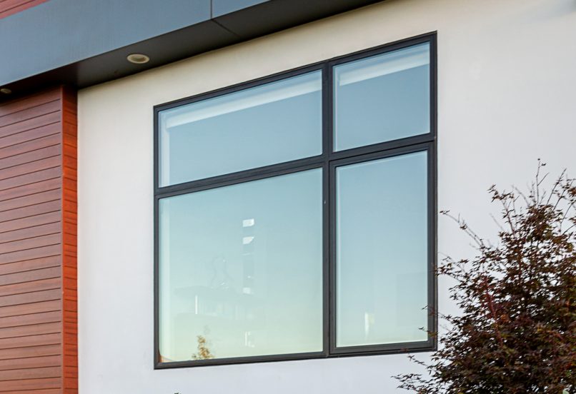 Close up of the side of a Modern Home with a window