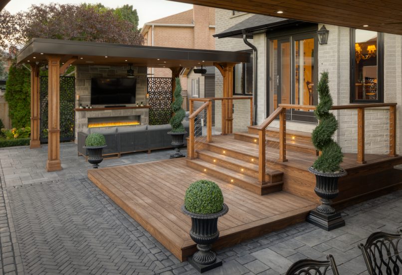 Steps with Lighting from Entrance to Backyard Patio with TV Wall and Fireplace