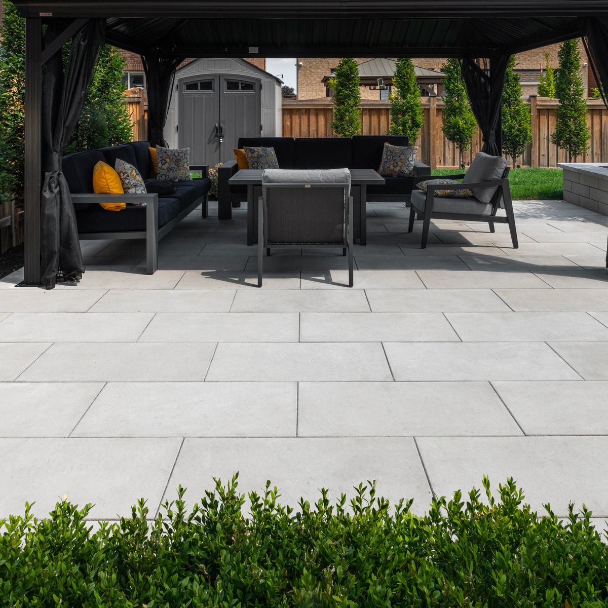 Large concrete pavers on an outdoor patio with canopy