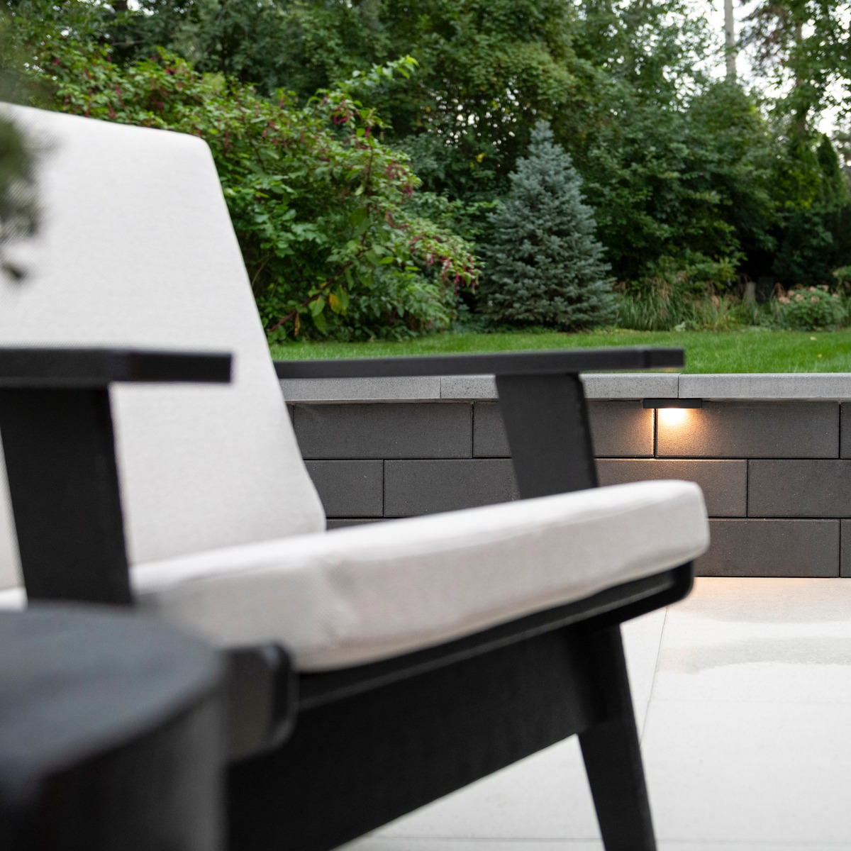 Large concrete paver patio with outdoor seating