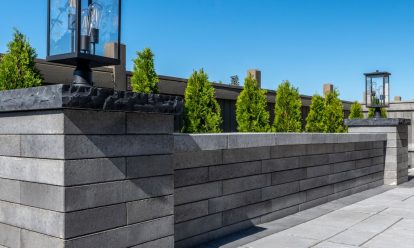 low seat retaining wall with lanterns