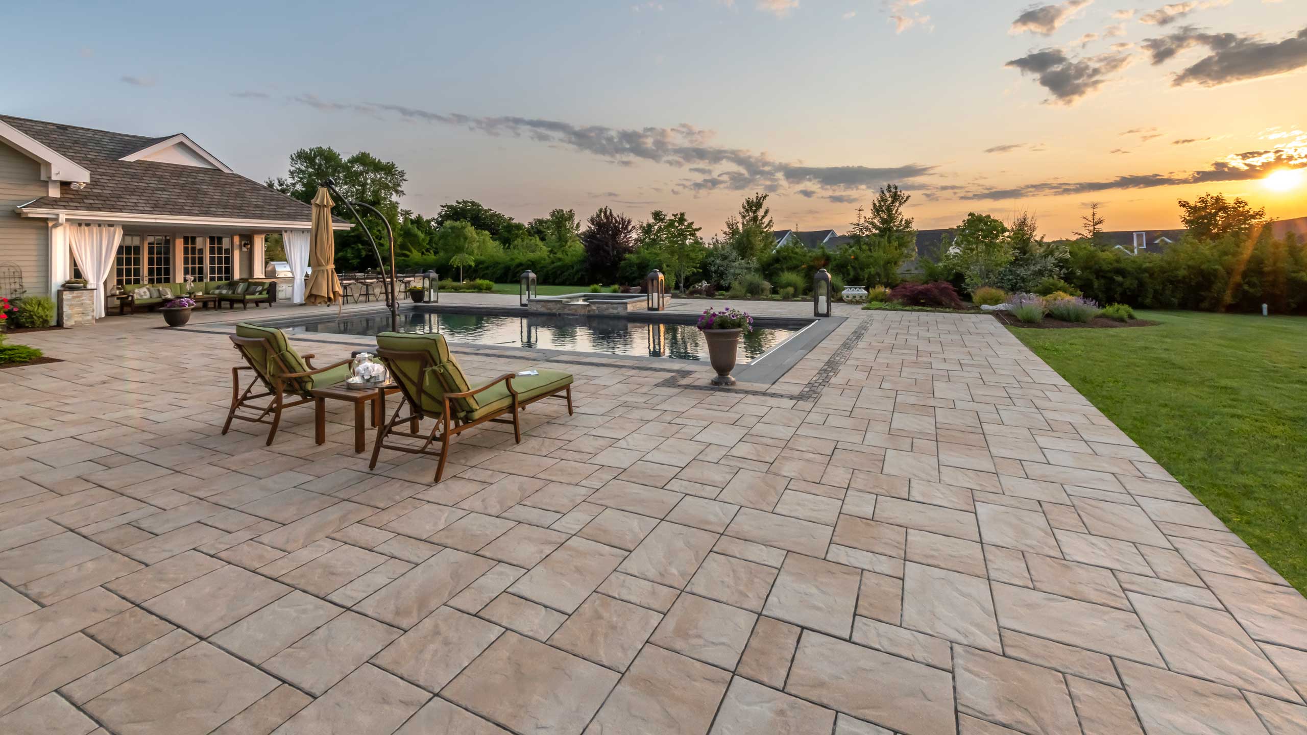 Walkway with flagstone pavers and pool deck Unilock