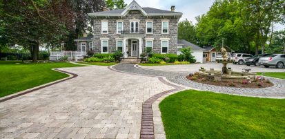 Unilock Courtstone heritage cobblestone walkway and entrance with antiqued Brussels Block driveway