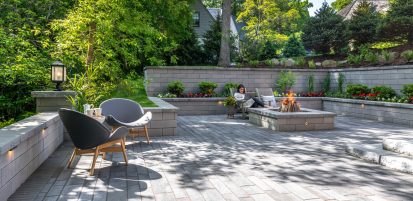 Unilock U-Cara retaining wall, fire feature and seat wall planter with Artline contemporary plank pavers