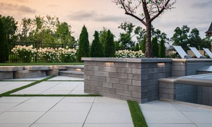 Paver patio with retaining garden wall and stone steps