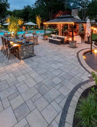 Summer Fun Backyard with Lighting and a Pool and Outdoor Kitchen and Fire Pit