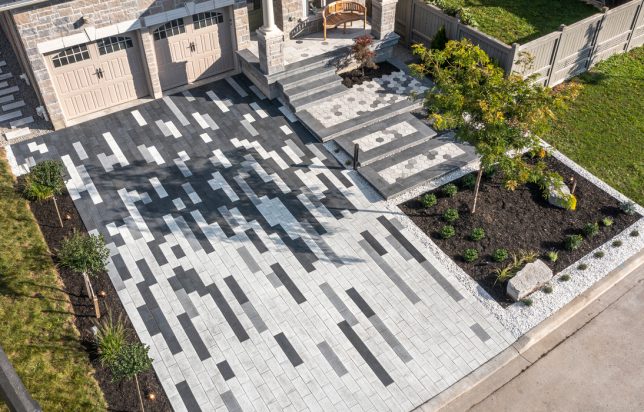 Unilock Interlocking Driveway with Unique Design with Steps to Front Entrance