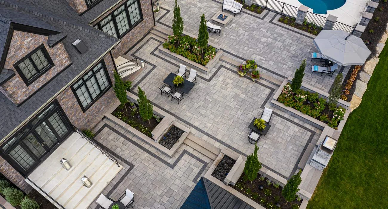 Backyard paver patio with hardscaping elements