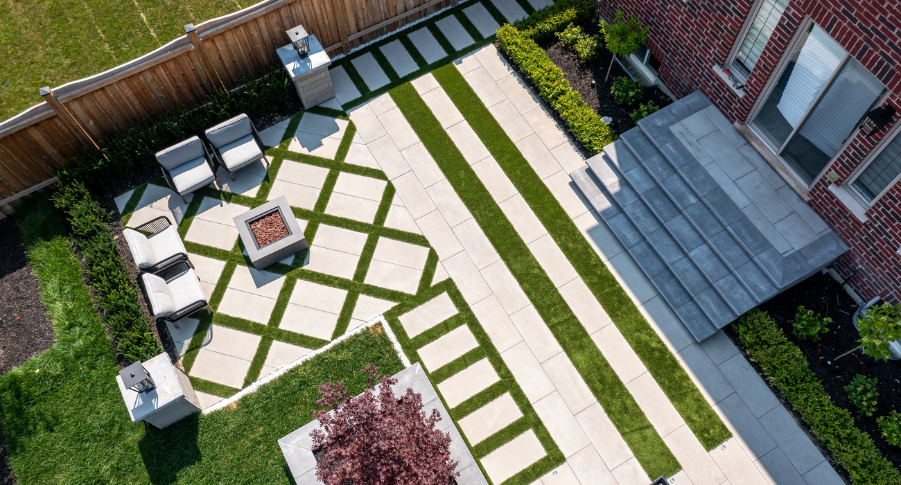 Mosaic-style paving design with artificial turf.