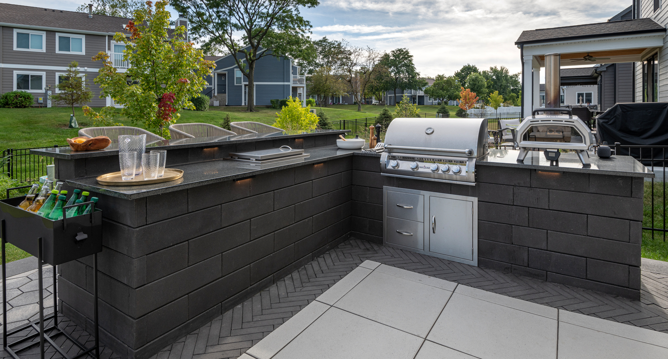 Outdoor kitchen on a backyard paver patio