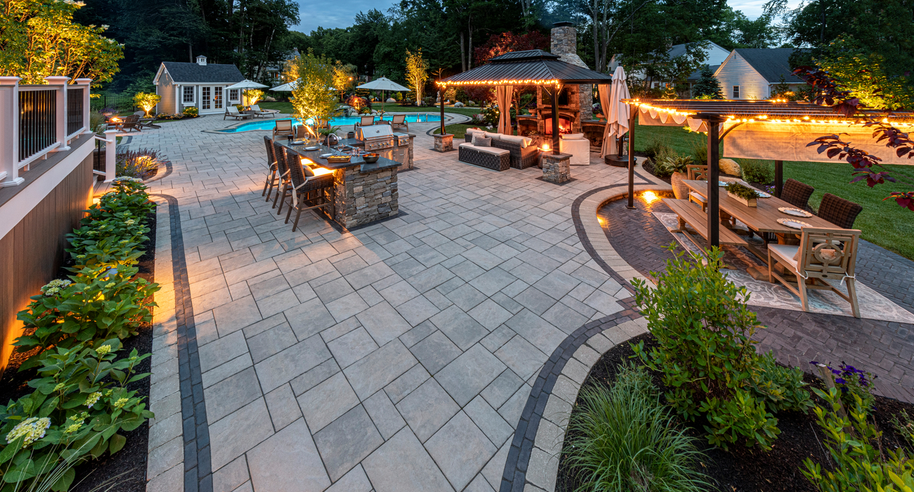 Backyard paver patio with lighting elements