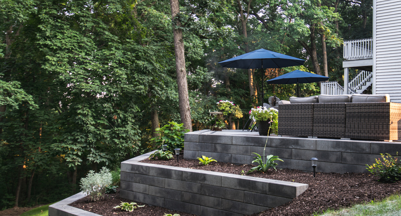 Tiered garden wall on paver patio