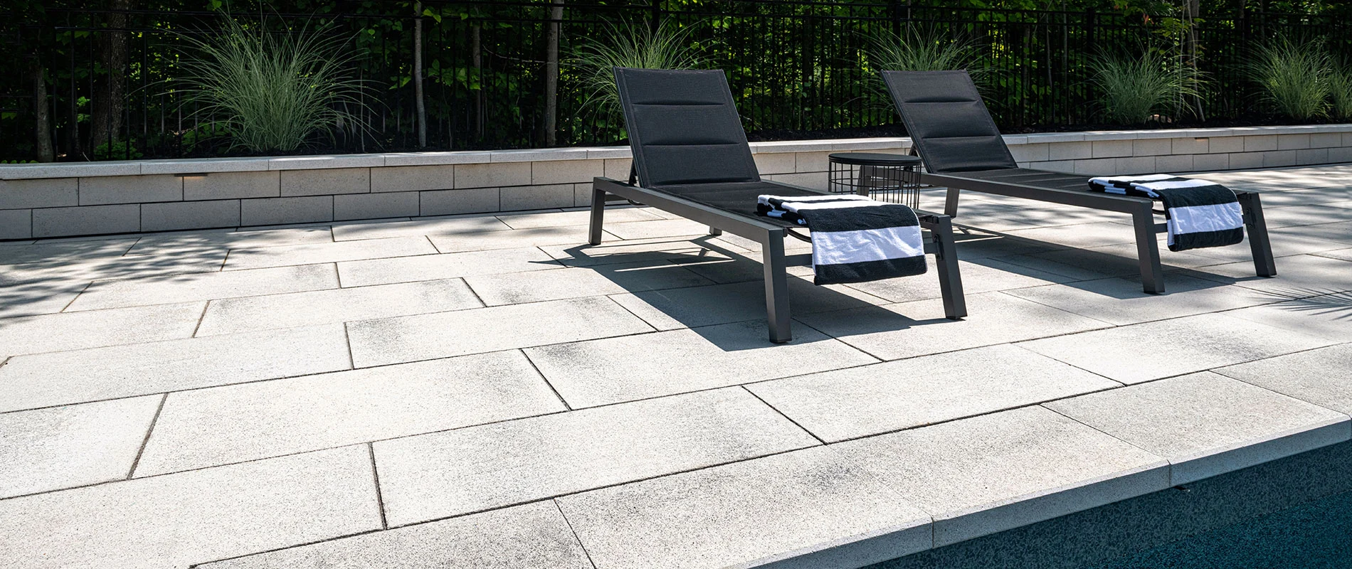 Pool coping with patio lounger chair