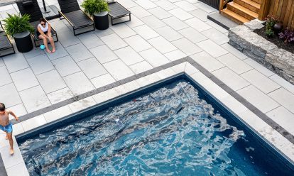 Swimming pool with coping with paver patio