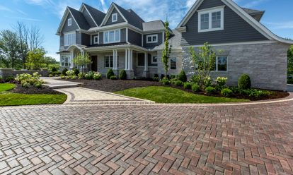 Paver driveway, front walkway and stone steps with landscape elements