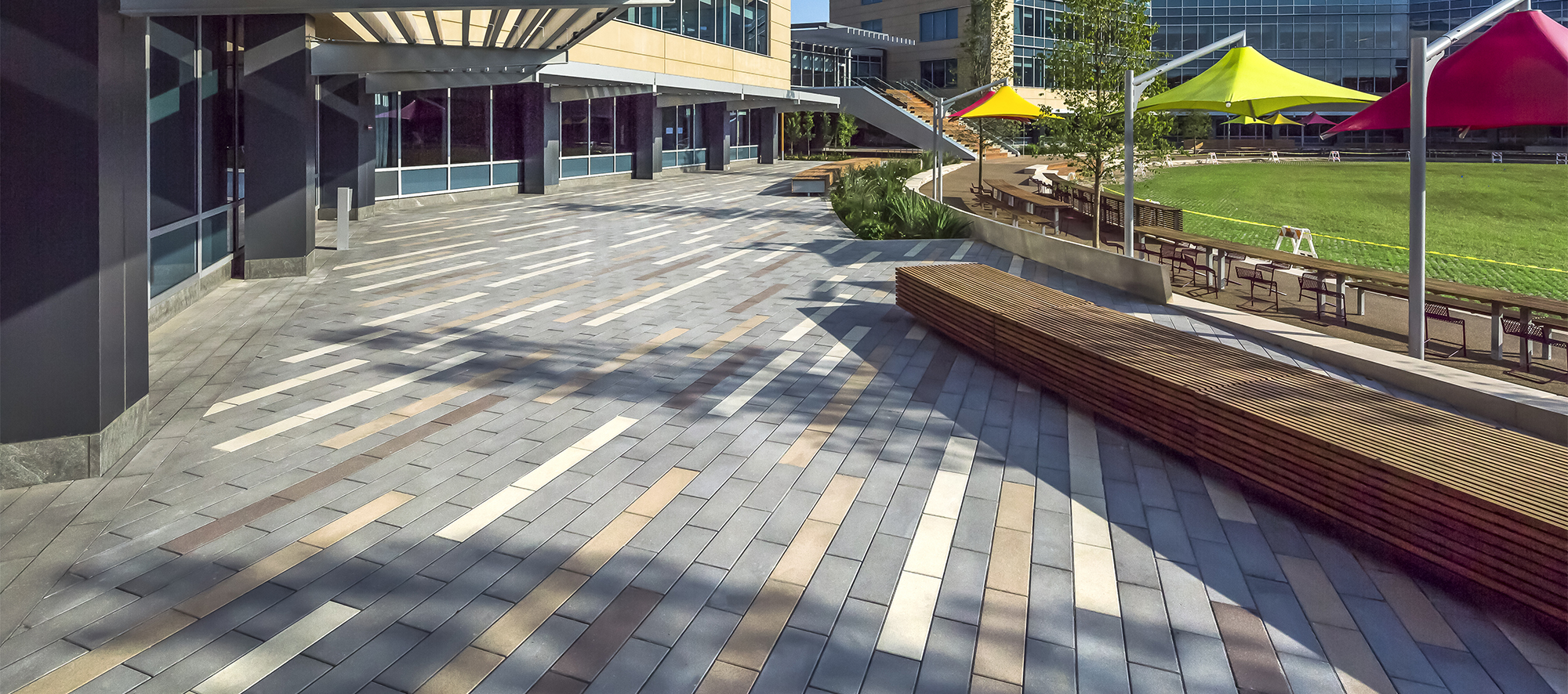 Promenade Planks in four unique colors give the impression of shooting stars along the front of the building, with subtle benches for rest.