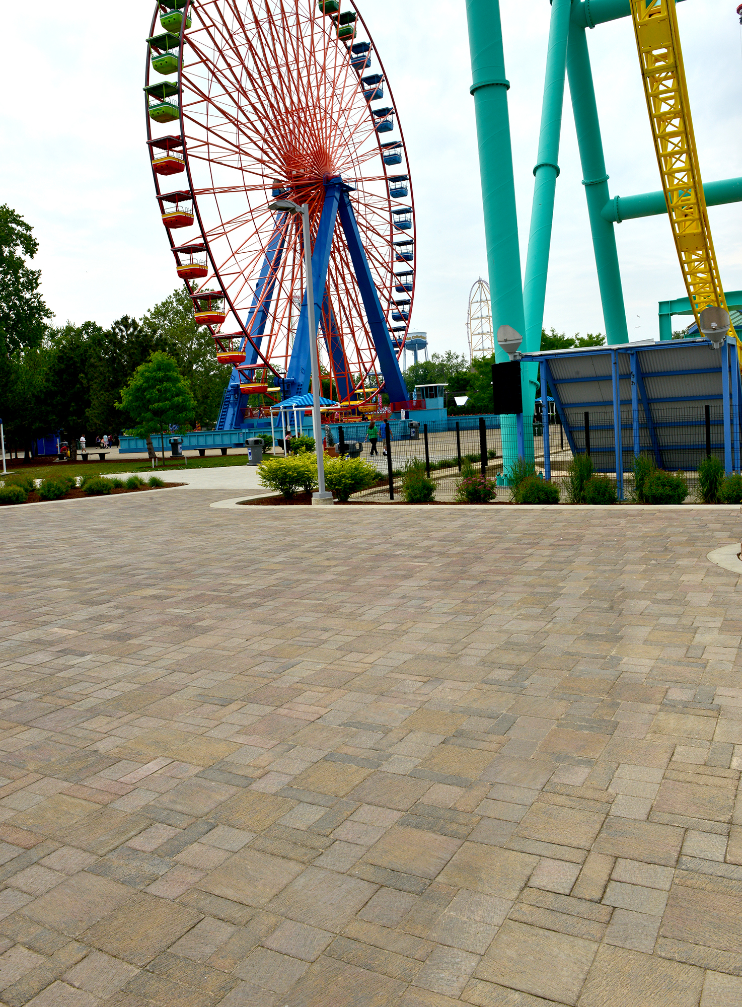 Beige Il Campo pavers allow the red and blue Ferris Wheel, as well as surrounding greenery to visually pop.