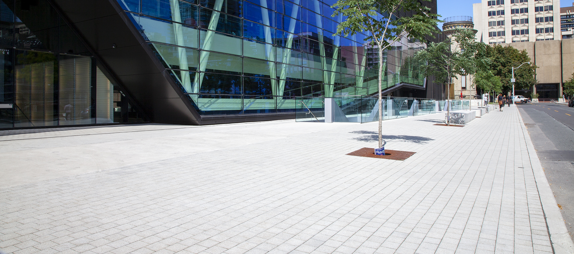 Muted Eco-Optiloc pavers elevate the visual appeal of nearby trees and the glass architecture of the student center.