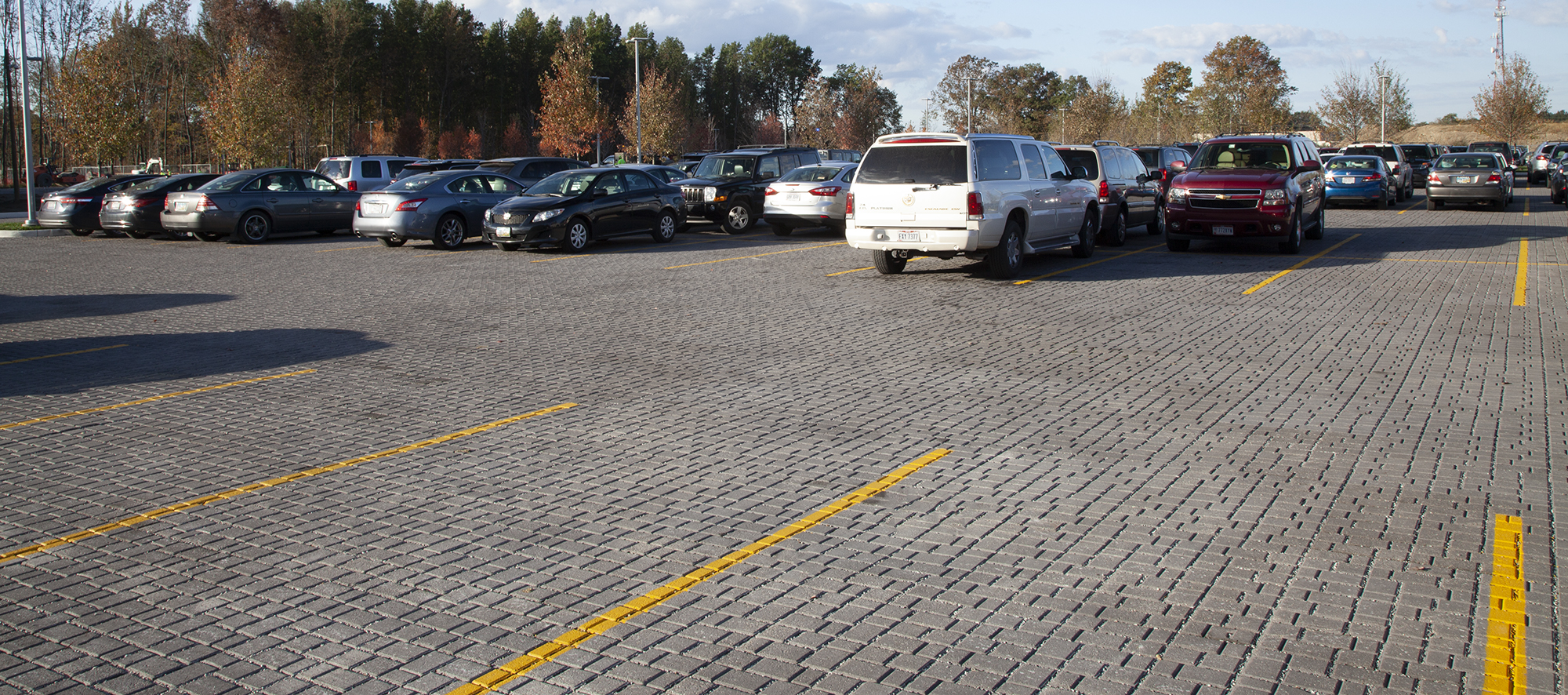 Painted yellow lines delineate parking spaces at the Cleveland Clinic, which features Eco-Optiloc™ pavers throughout the space.