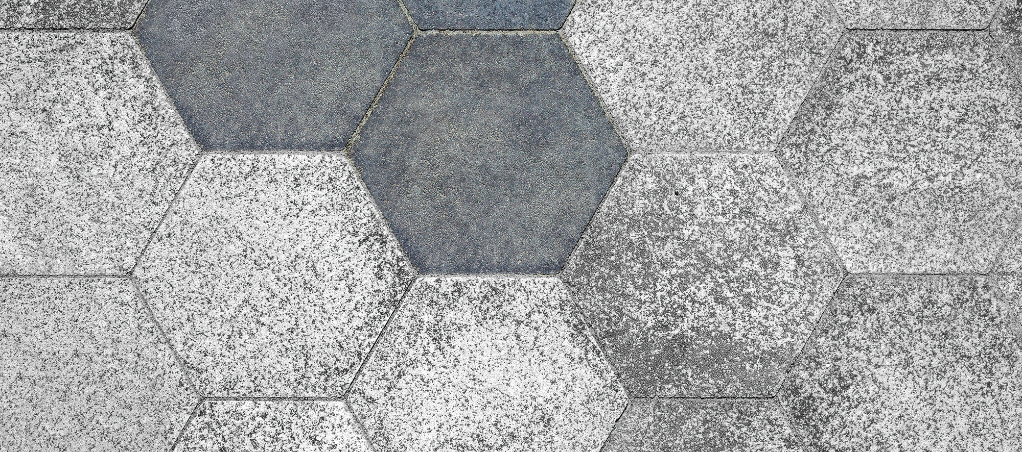Amherst College campus features a stimulating pixelated design pattern, featuring the hexagonal City Park Paver in two tones.