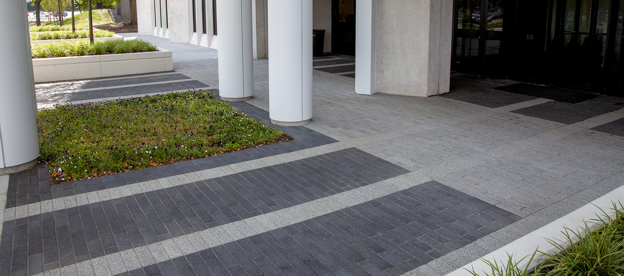 Two-toned Promenade Plank pavers define distinct walkways leading to and from the Continental Towers in Chicago.